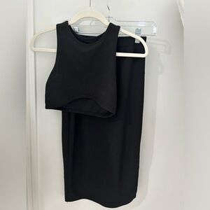 black tank top and midi skirt set with a slit